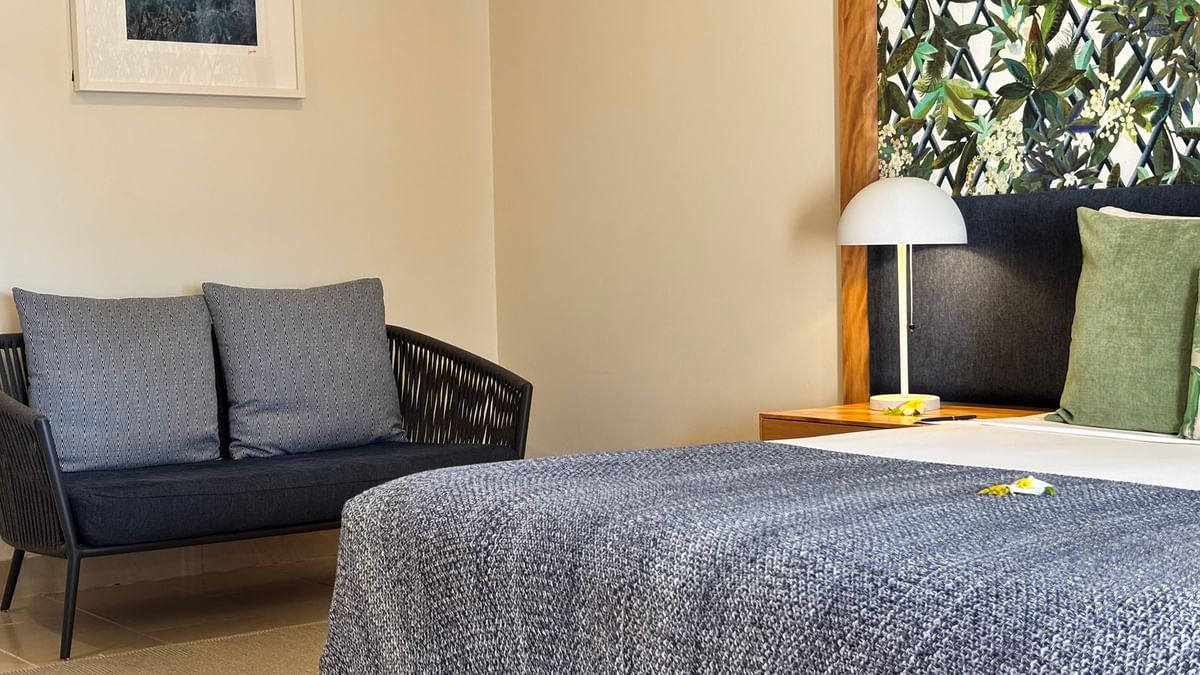 Lagoon Superior Room with couch and bed at Warwick Le Lagon Efate.