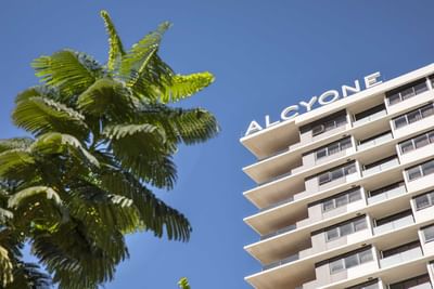 Low-angle exterior of Alcyone Hotel Residences which is close to Brisbane airport
