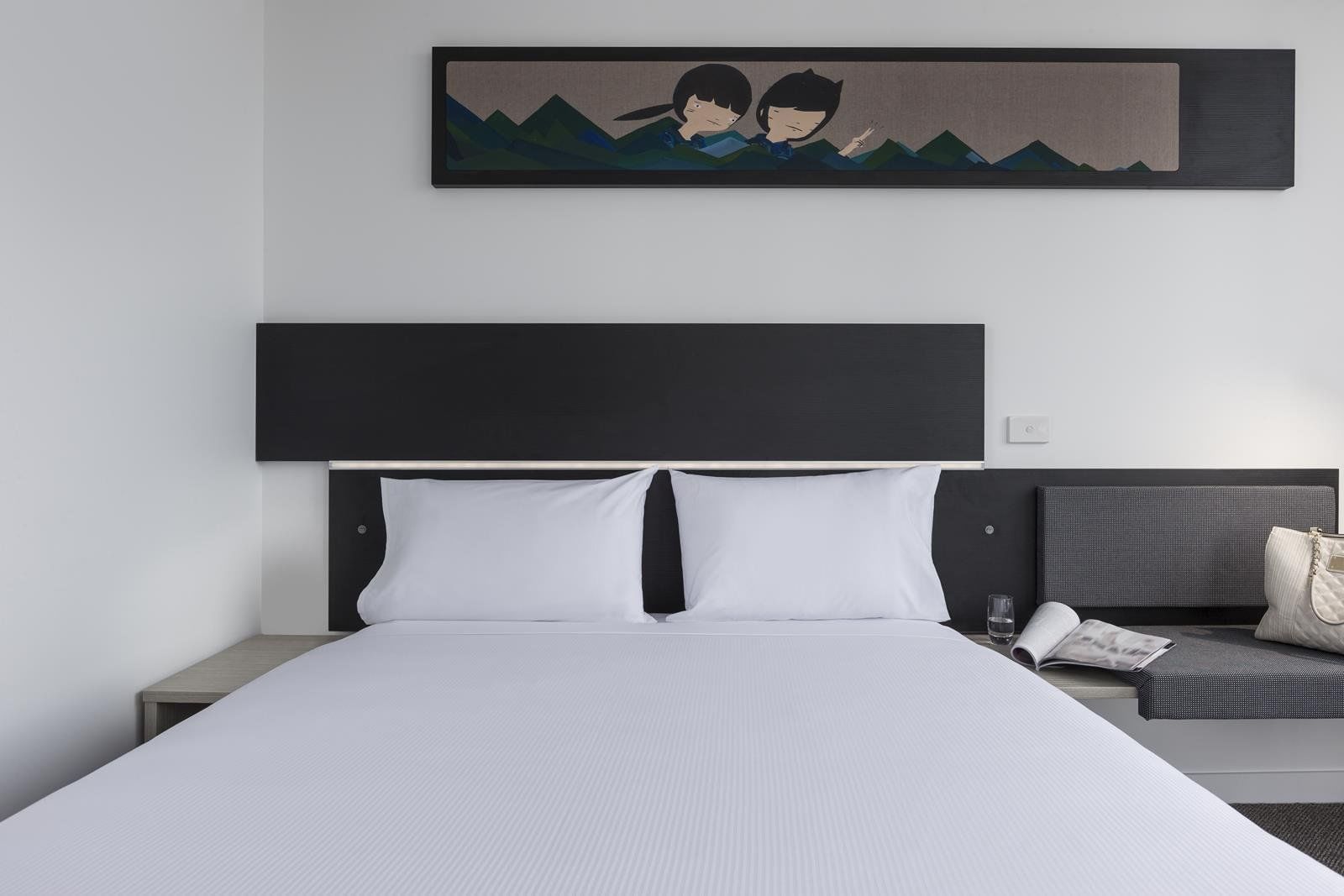 Cozy bed with hanging wall art in Standard Room, One Queen Bed at Ibis Adelaide