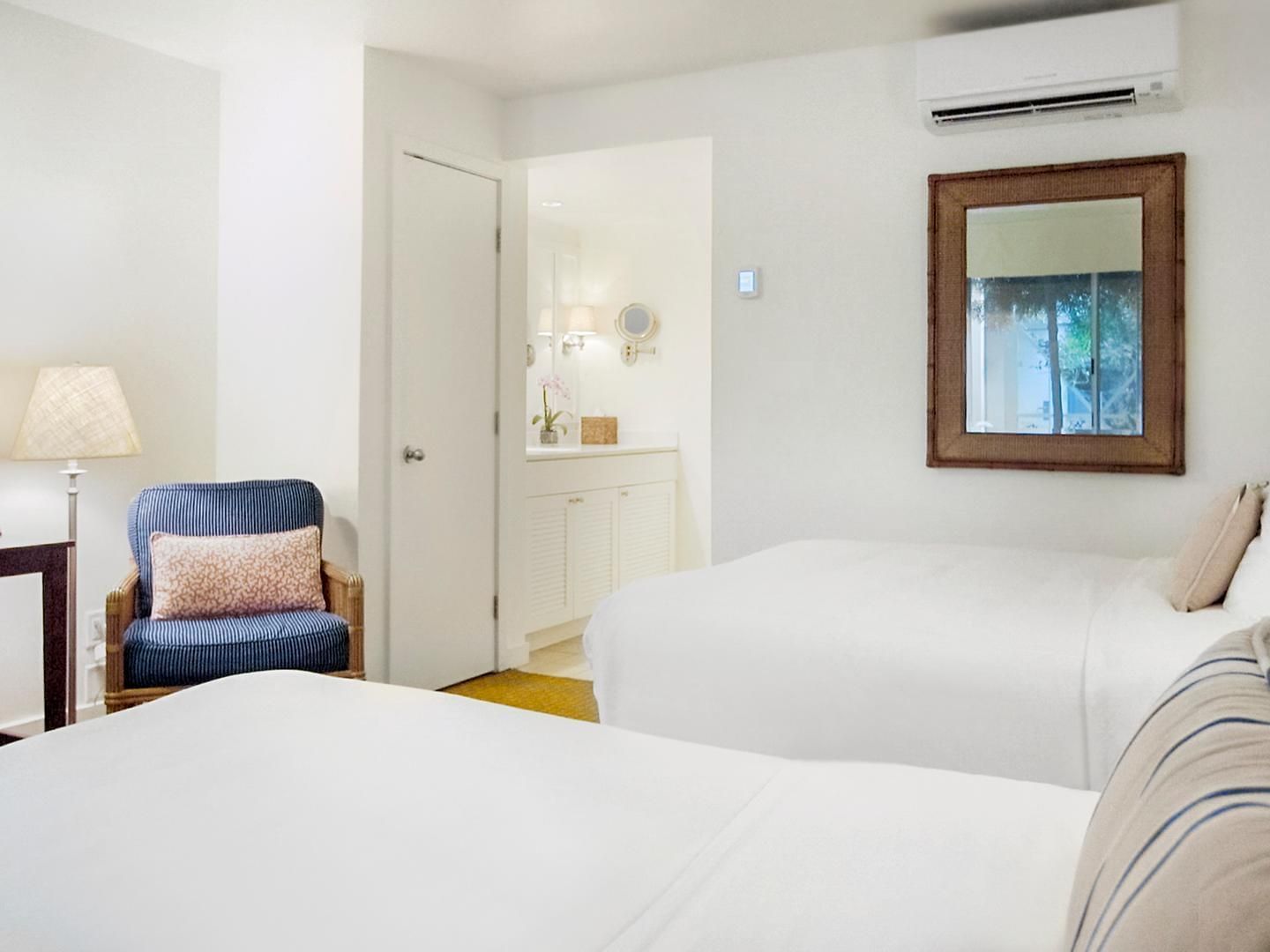 Lounger and lamp by the beds in Superior Double Room at Pavilion Hotel