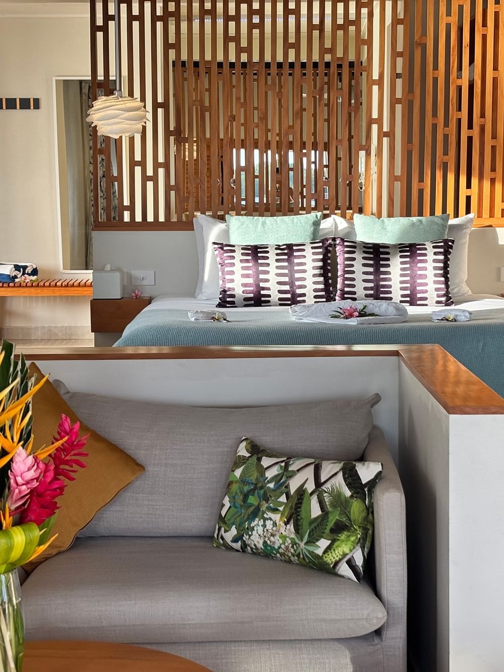 Overwater Villa at Warwick Le Lagon Vanuatu in Efate featuring a living area and bedroom.