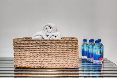 Close-up of Basket of towels & few bottles at South Beach Hotel