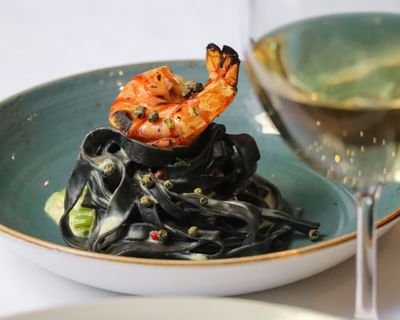 Squid ink pasta with prawn pasta served at SENS Hotel