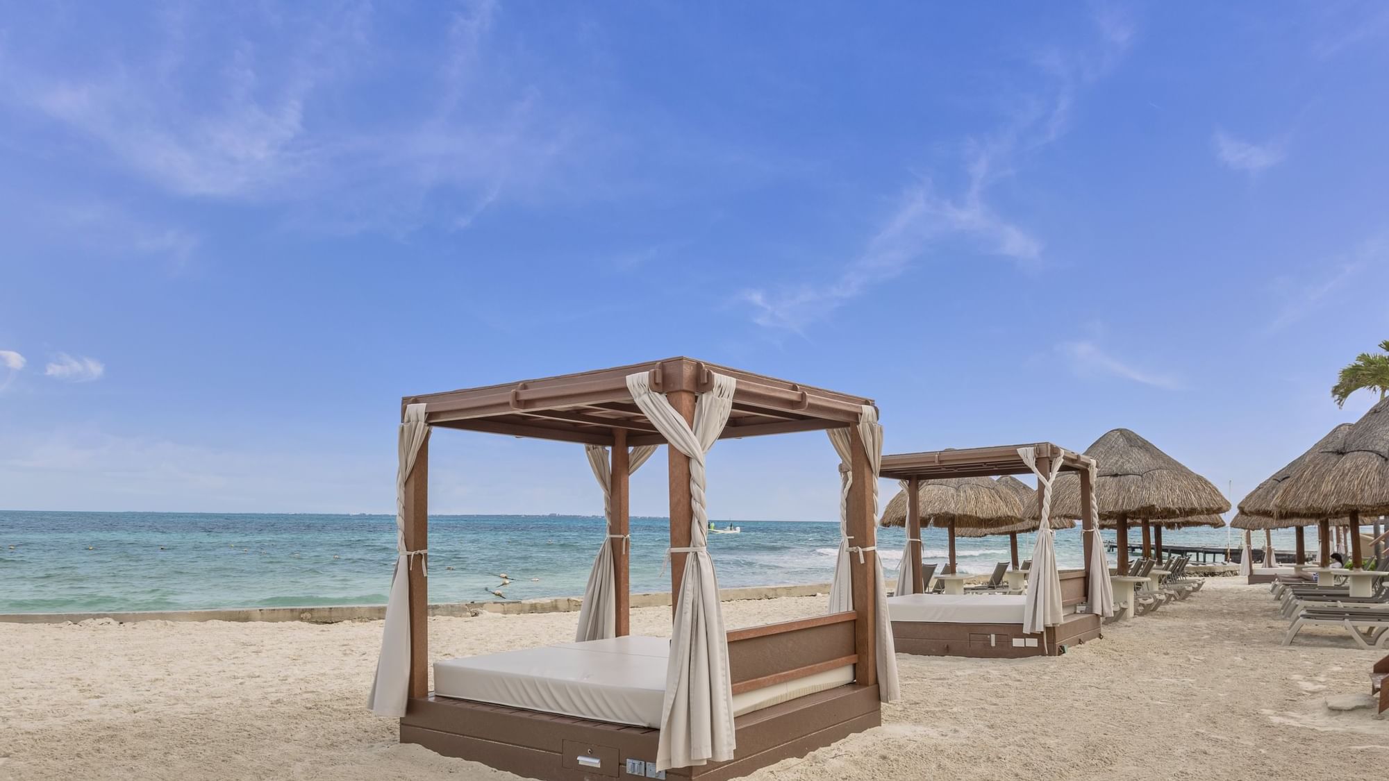 Beach cabanas by the beach at FA Hotels & Resorts