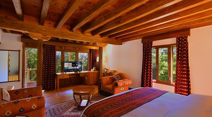 King bed and furniture in a room at Serena Altit Fort