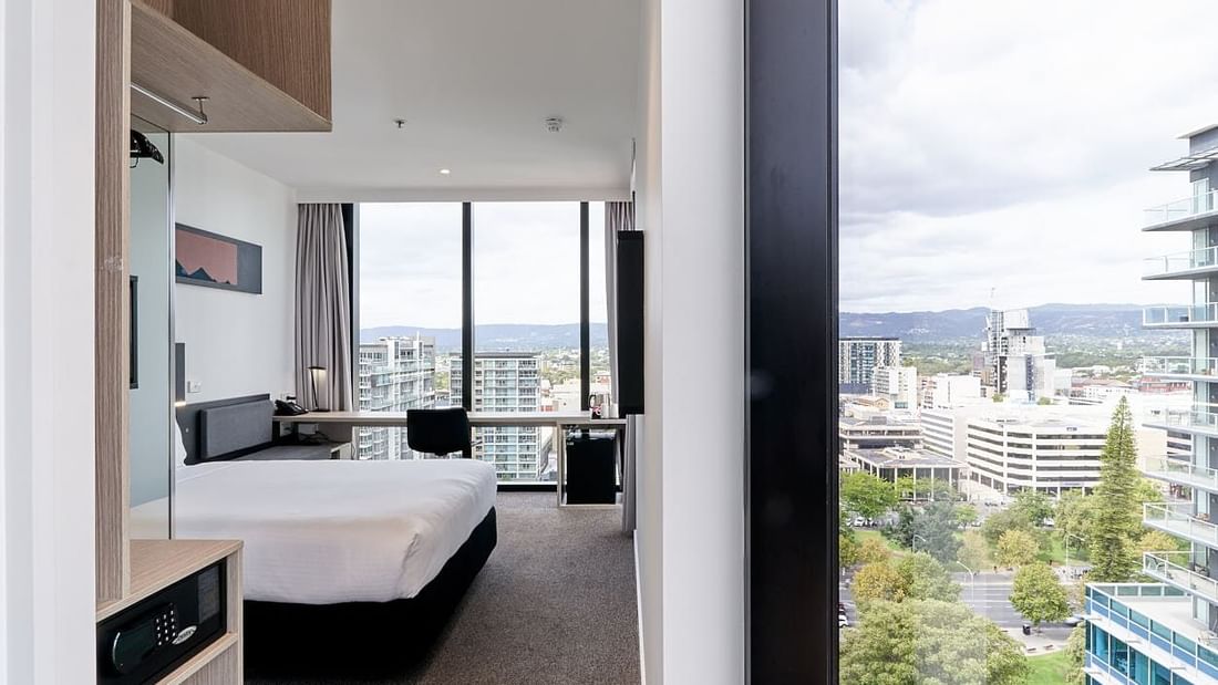 Special Access Room featuring a spacious bathroom and workspace with a city view at Ibis Adelaide