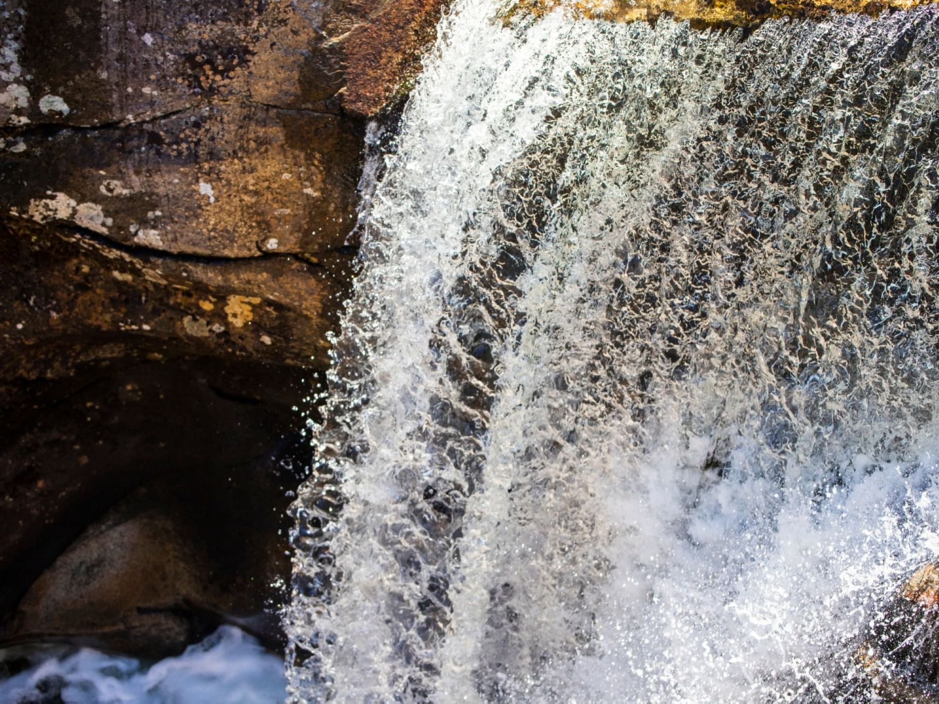 Close-up of a waterfall splashing on the boulders near The Bethel Inn Resort & Suites