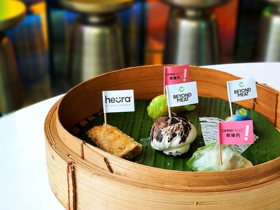 A bamboo basket containing an array of foods at Park Hotel Group