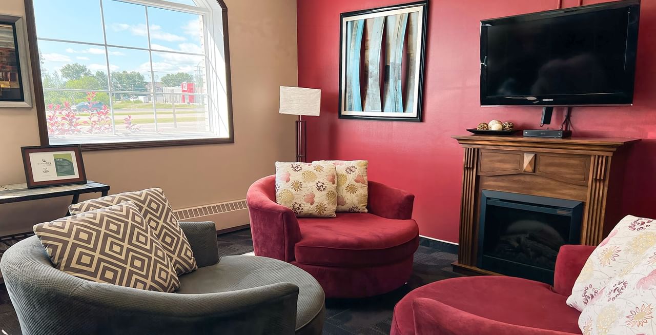 Coast Swift Current Hotel Lobby with couches and TV