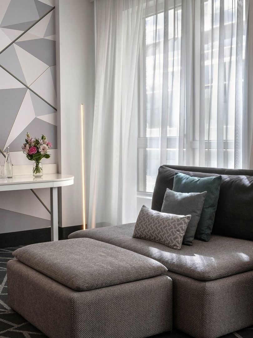 Premium Loft Suite with a sofa and work desk near the window at Warwick Le Crystal Montreal