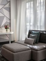 Premium Loft Suite with a sofa and work desk near the window at Warwick Le Crystal Montreal