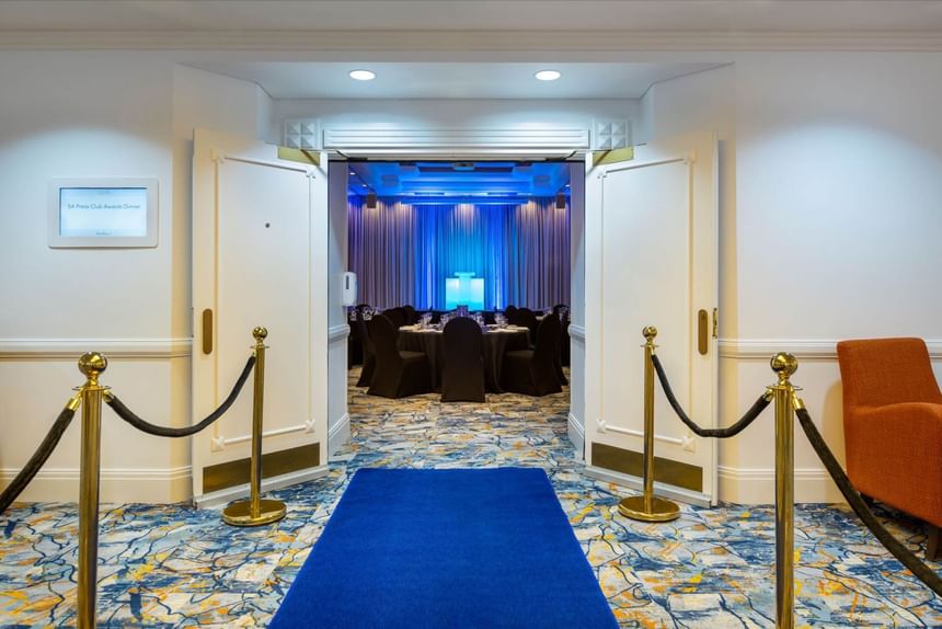 Entrance of Hindley Ballroom with blue carpet & gold ropes at Hotel Grand Chancellor Adelaide
