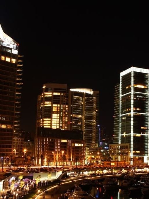 Zaitunay Bay by a city street under a night sky near Warwick Stone 55 - Beirut