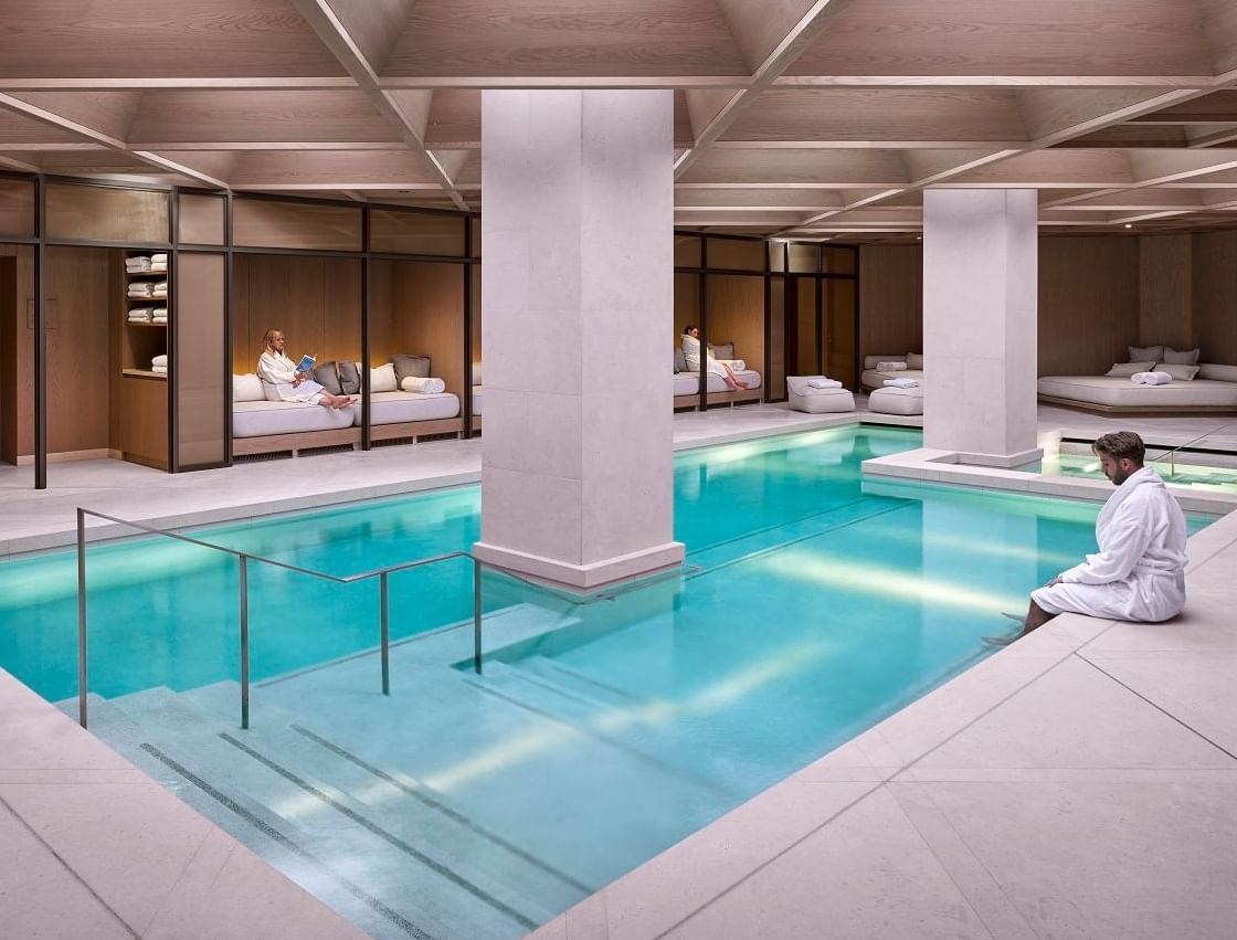 Interior of the indoor pool at The Londoner Hotel