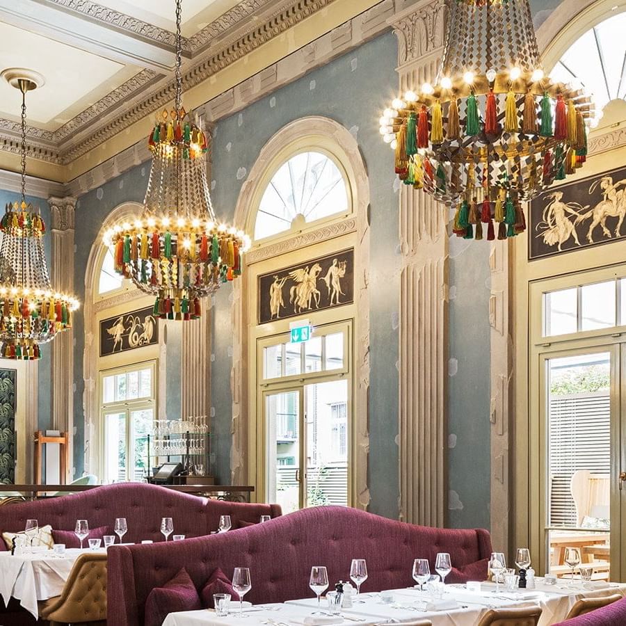 Dining area in Razzia with chandelier lights near Hotel Sternen