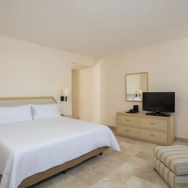 King bed in Superior Room with TV at Fiesta Inn