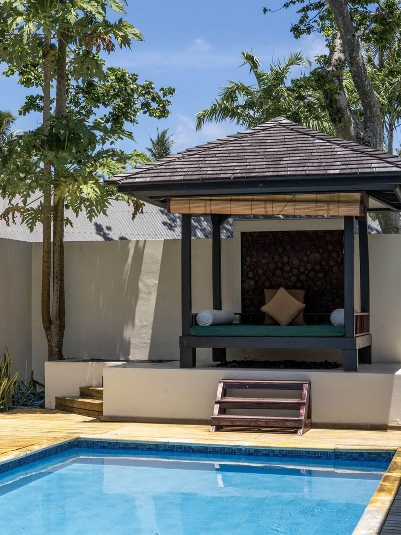 Private outdoor swimming pool with a wooden deck and a cozy garden in Pacific Pool Villa at warwick le lagon-vanuatu 