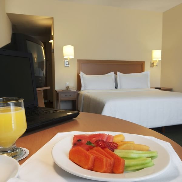 Fruit plate & juice served at Superior Room in Fiesta Inn