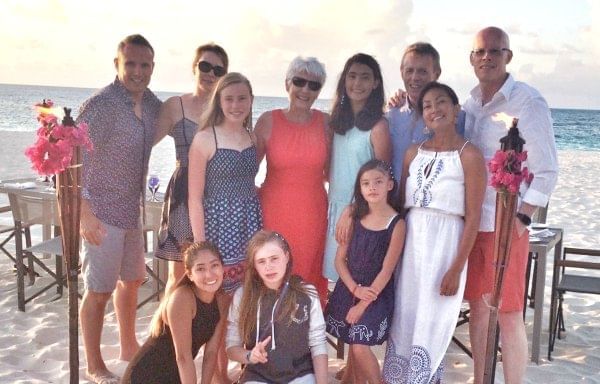 Family posing at the beach near The Somerset on Grace Bay