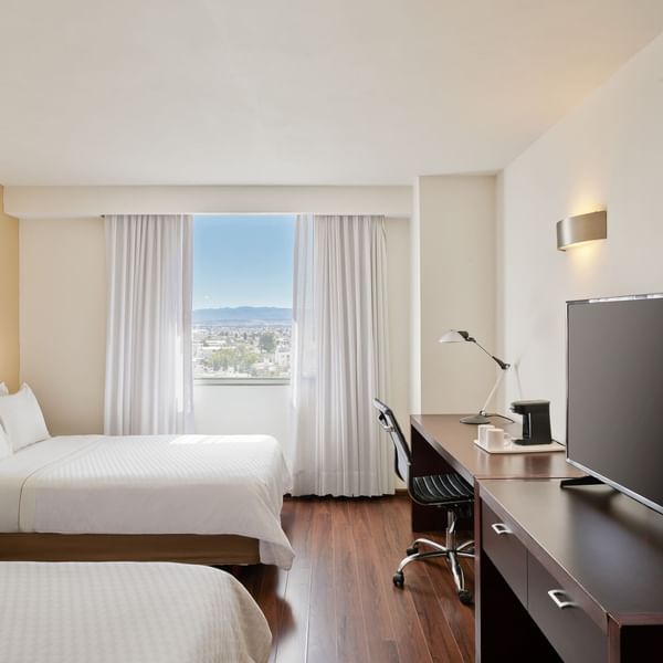 Two Double beds & TV in Executive Room at Fiesta Inn