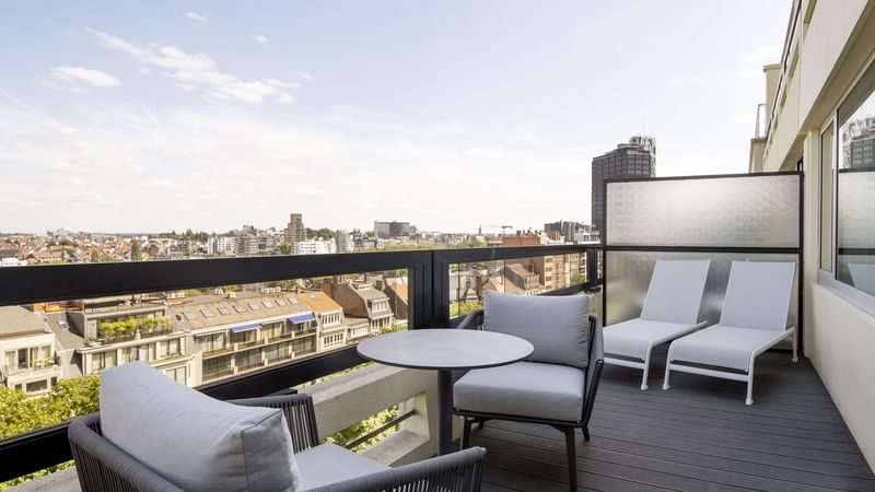 Terrace with cozy seating area & a city view in Junior Suite at Hotel Barsey by Warwick - Brussels