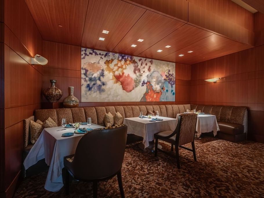 Elegant dining area with a warm embrace in Herons at The Umstead Hotel and Spa