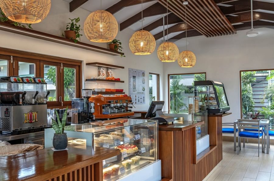 Coffee shop with pastries and a coffee machine at Tokatoka Resort - Fiji International Airport.