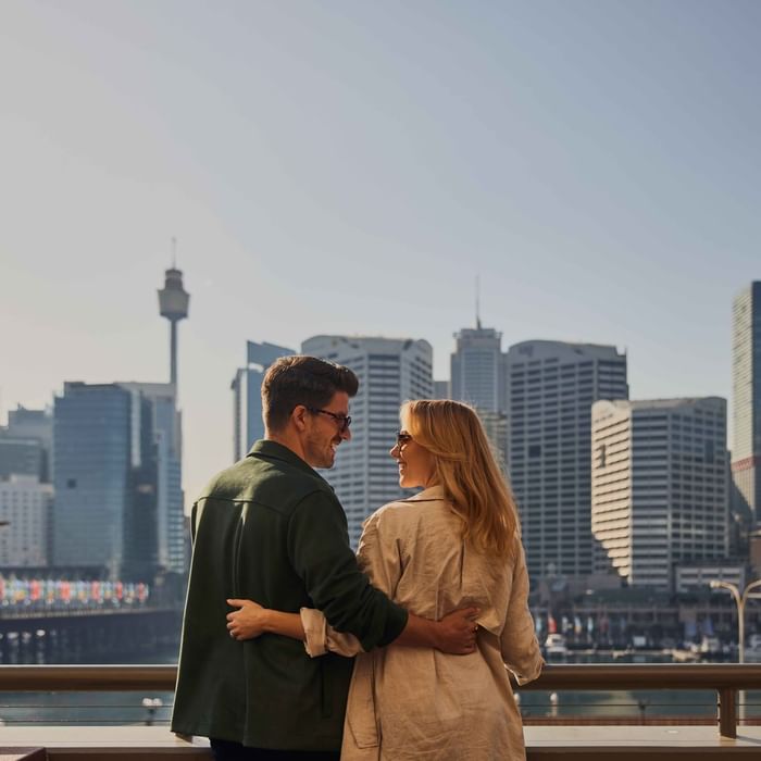 Couple enjoying sunset drinks on ibis bar deck