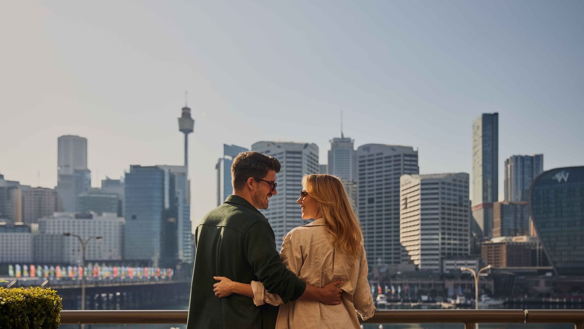 Couple enjoying sunset drinks on ibis bar deck