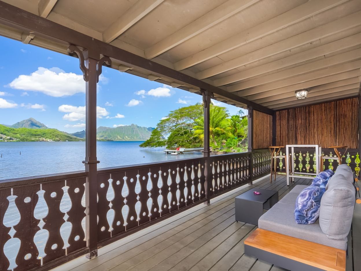 Balcony lounge area in One-Bedroom Two-Bath “Hale Lily” Waterfront Suite at Paradise Bay Resort