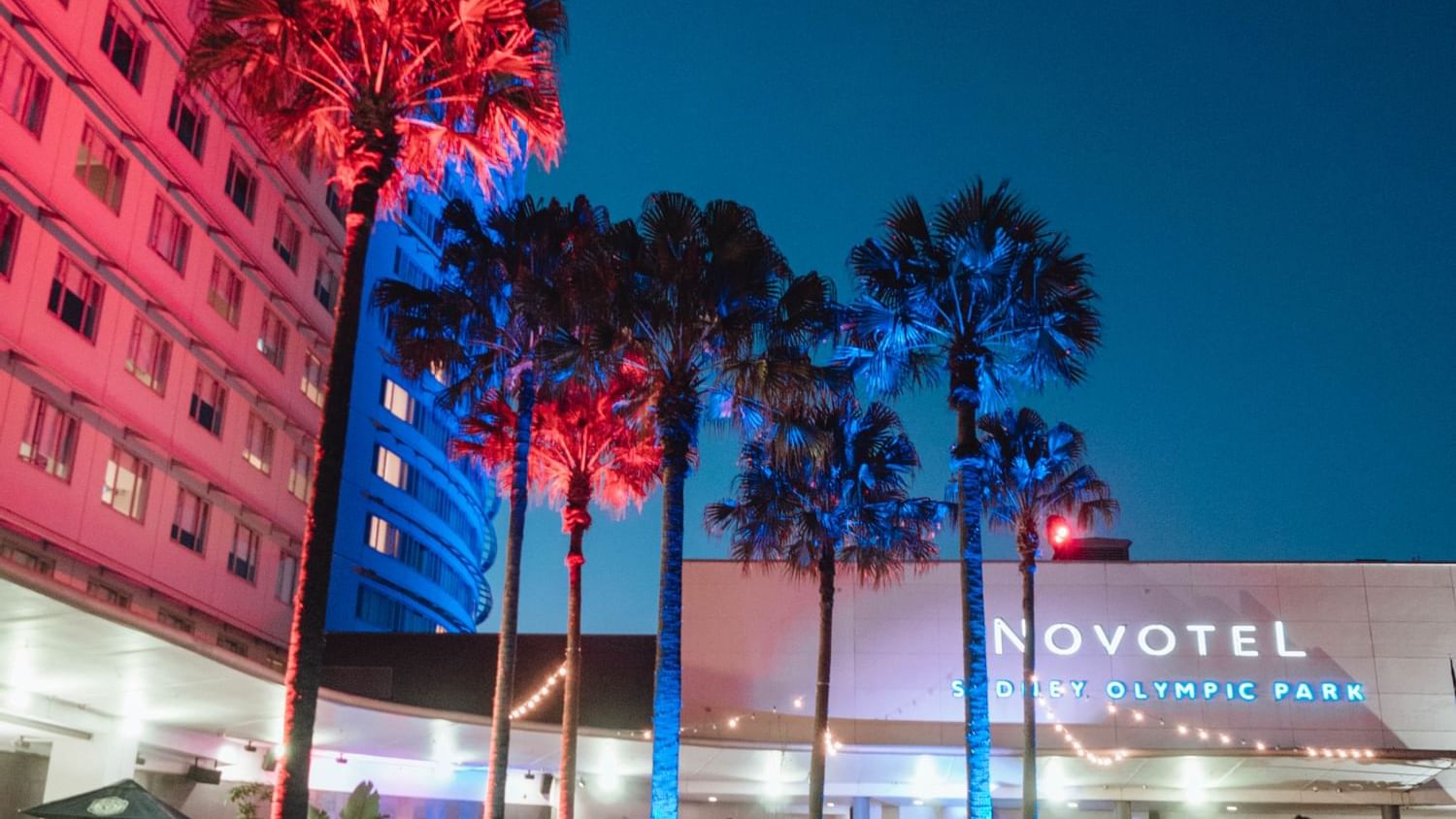 Night view of the entrance at Novotel Sydney Olympic Park