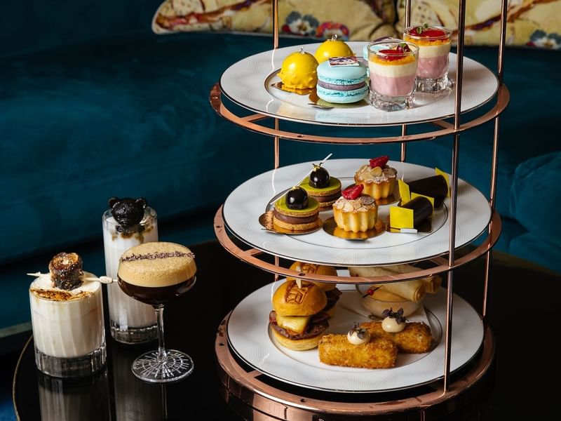 Three-tiered dessert stand filled with pastries & sweets in Twr at 
Crown Towers Perth