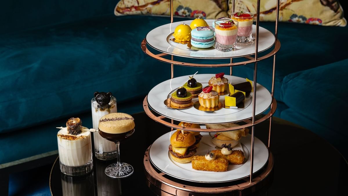 Three-tiered dessert stand filled with pastries & sweets in Twr at 
Crown Towers Perth