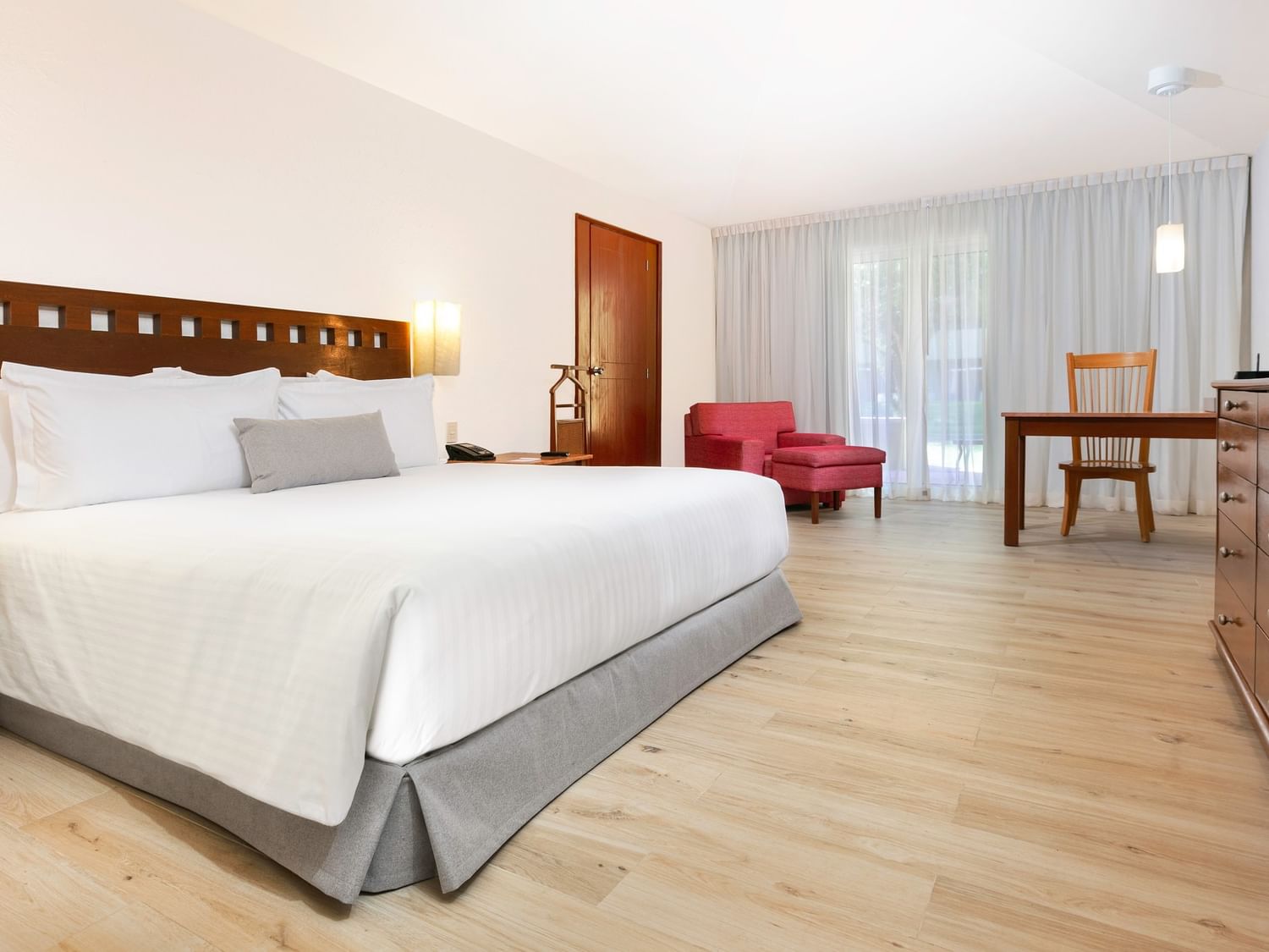 King Presidential Suite with large bed, desk, and chair at Camino Real Guadalajara in Zapopan