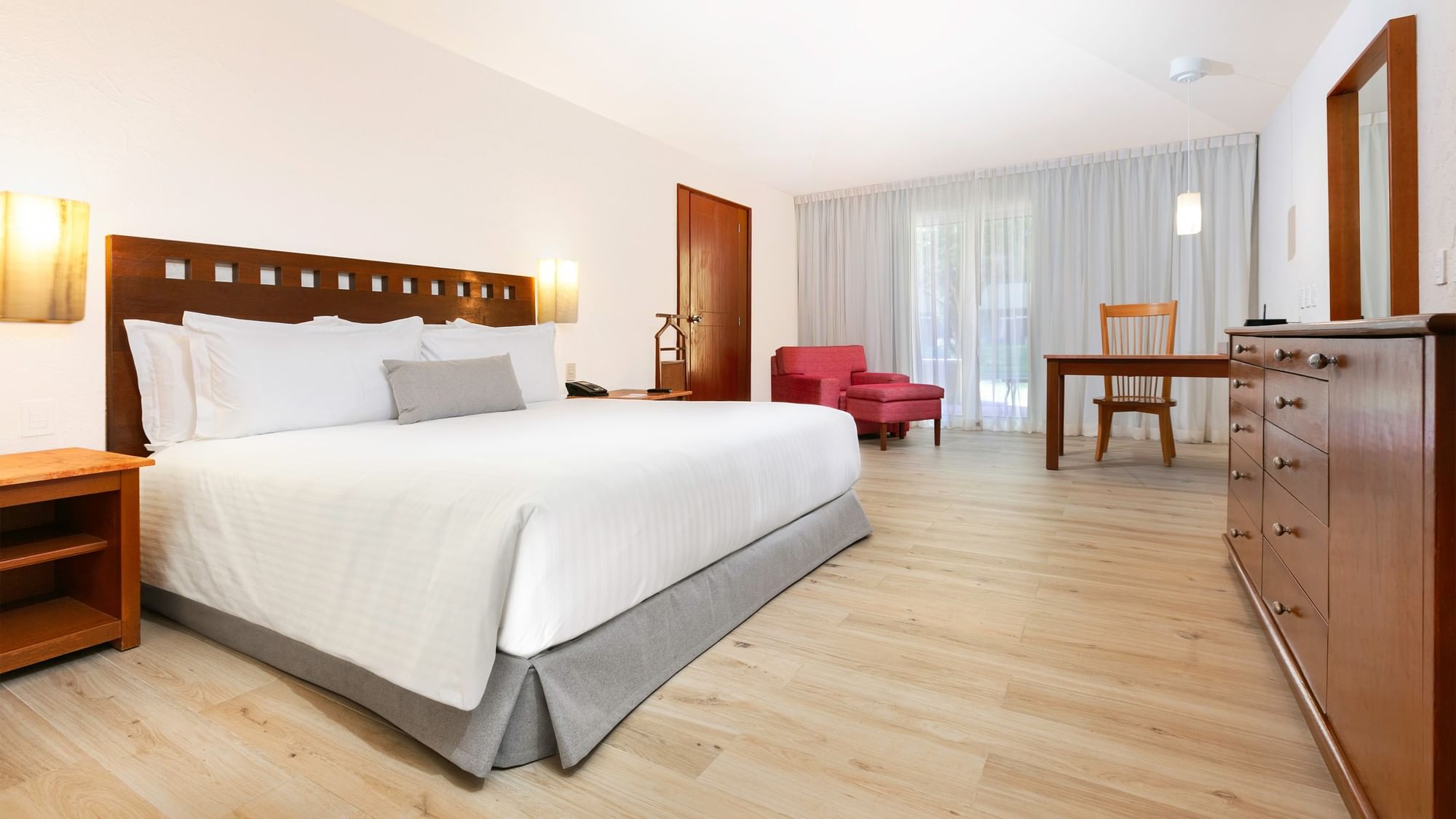 King Presidential Suite with large bed, desk, and chair at Camino Real Guadalajara in Zapopan