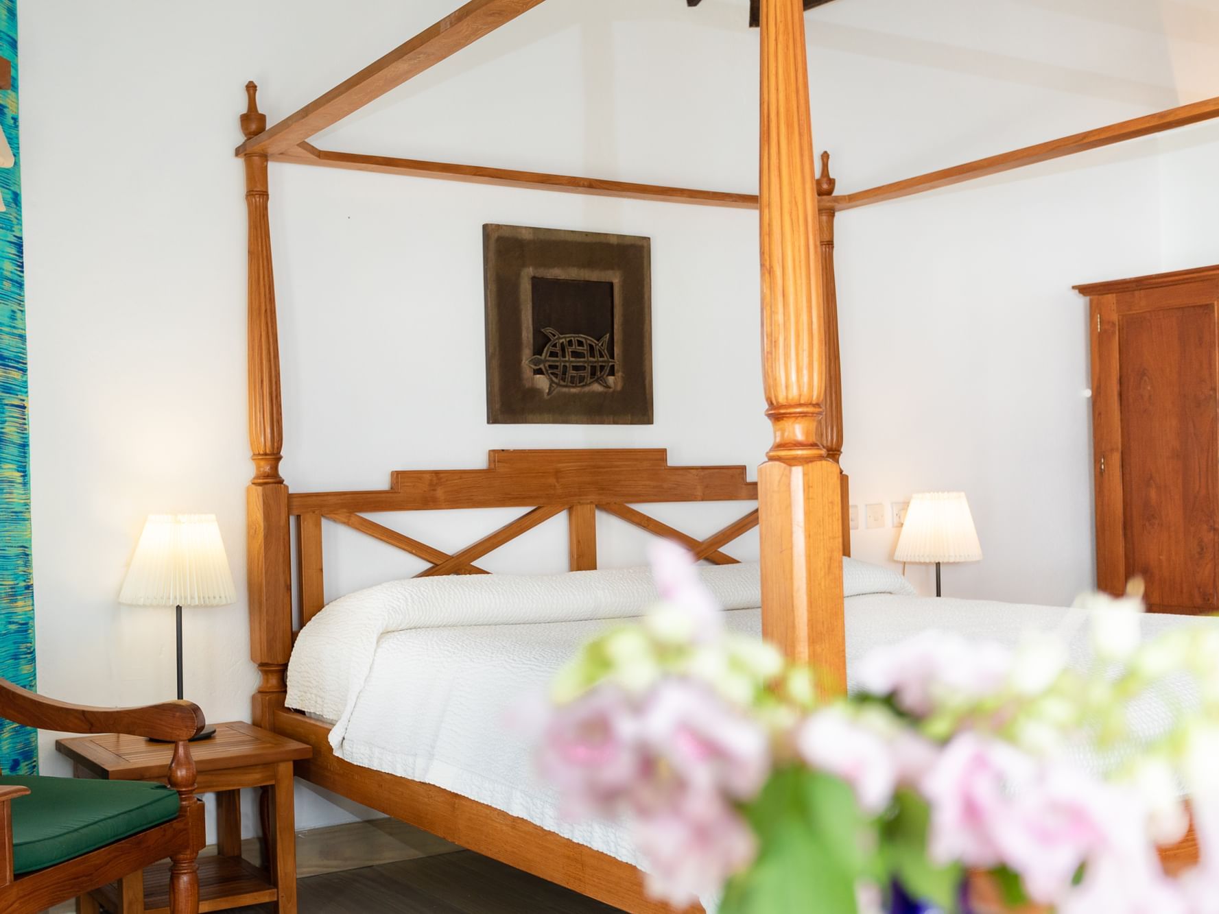 Canopy bed & chair in True Blue Room at True Blue Bay Resort