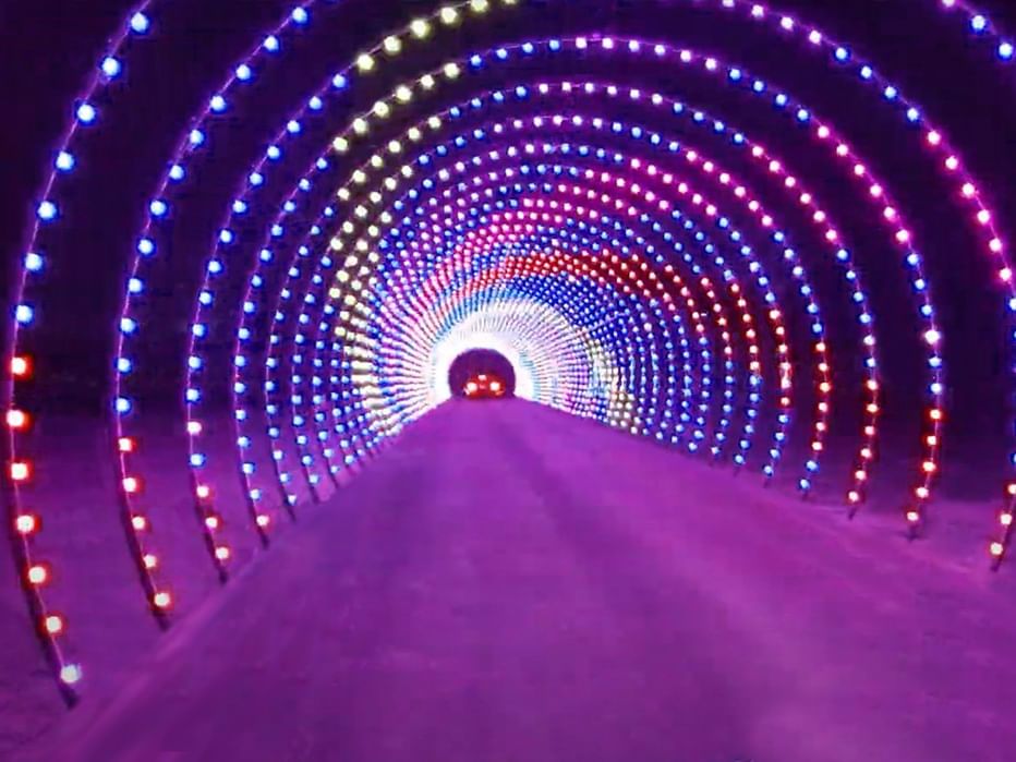 car in tunnel of lights for Christmas 