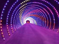 car in tunnel of lights for Christmas 