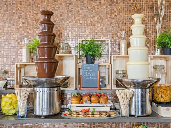 Close-up of Chocolate fountains arranged in Téséo Restaurant at Warwick Geneva
