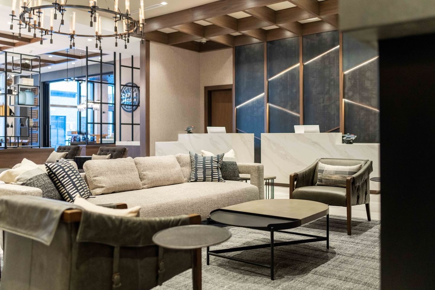 Indoor restaurant lounge area by a firepit at The Artisan Hotel at Tuscan Village