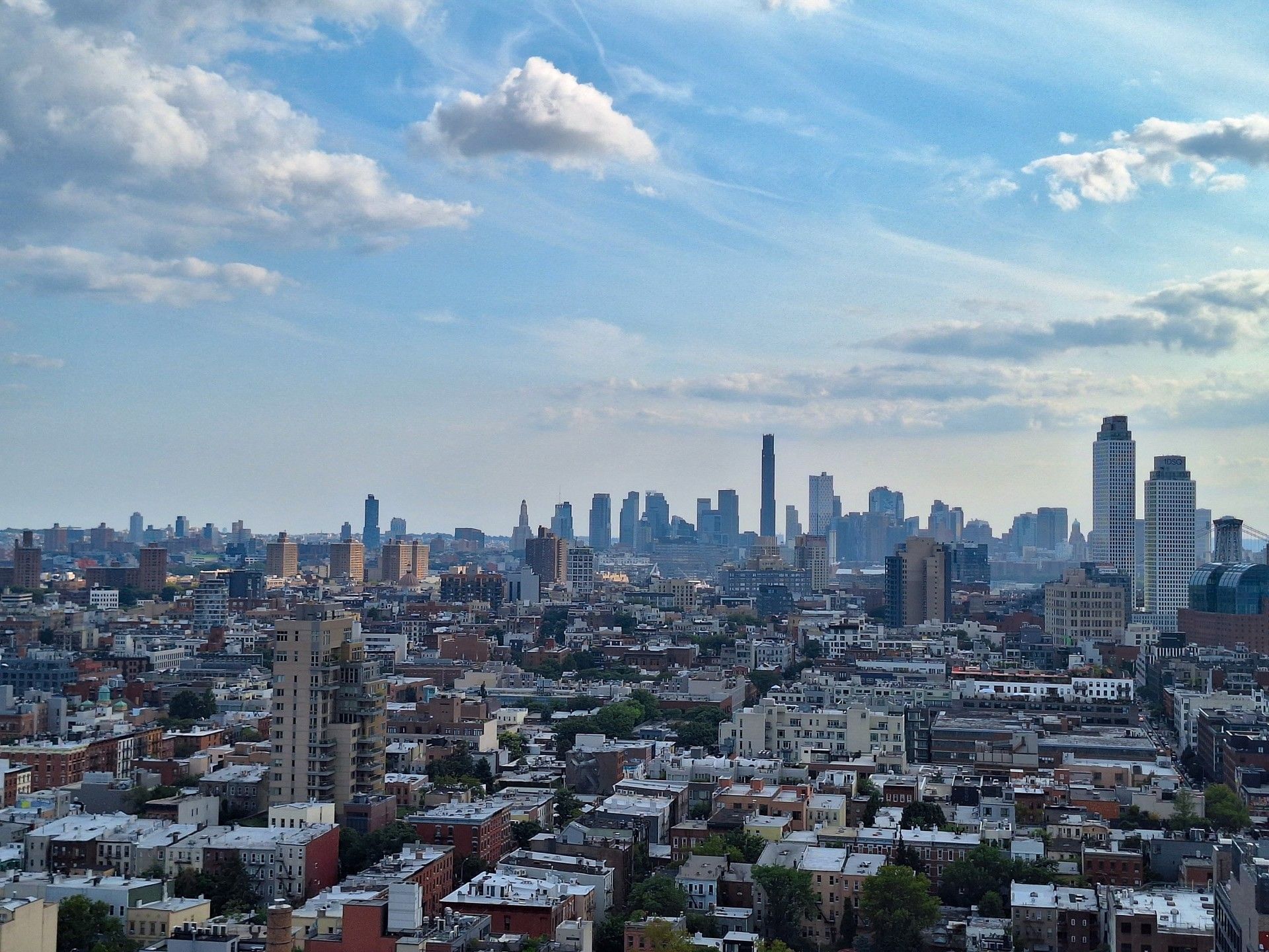 Sunset over the Brooklyn Bridge and city skyline near Warwick New York hotel