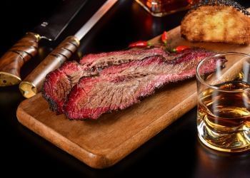 Brisket served with Cinnamon Whiskey in Father's Day Lunch poster used at Amora Hotel Jamison Sydney