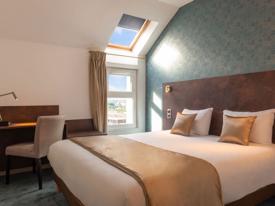 Double bedroom with Velux roof window at Hotel Orleans North