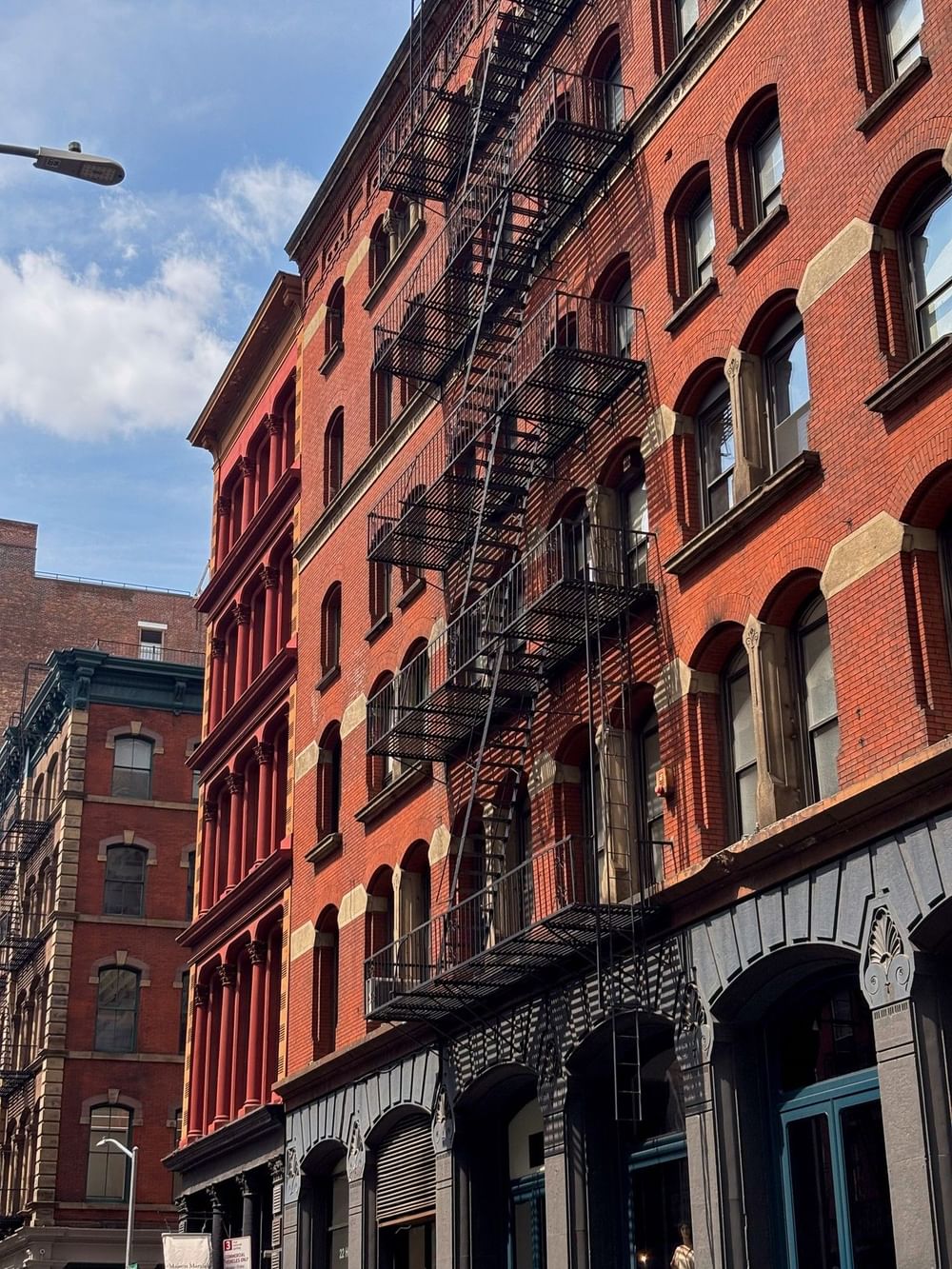 Historic red brick building featuring classic black fire escapes near Warwick New York