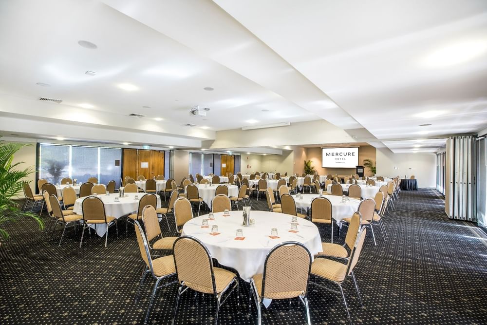 Banquet table set-up in Ballroom with carpeted floors at Mercure Hotel Townsville