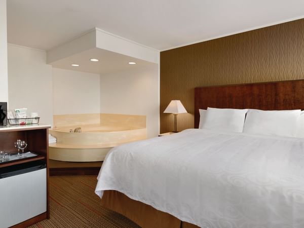 Bed and tub in hotel room