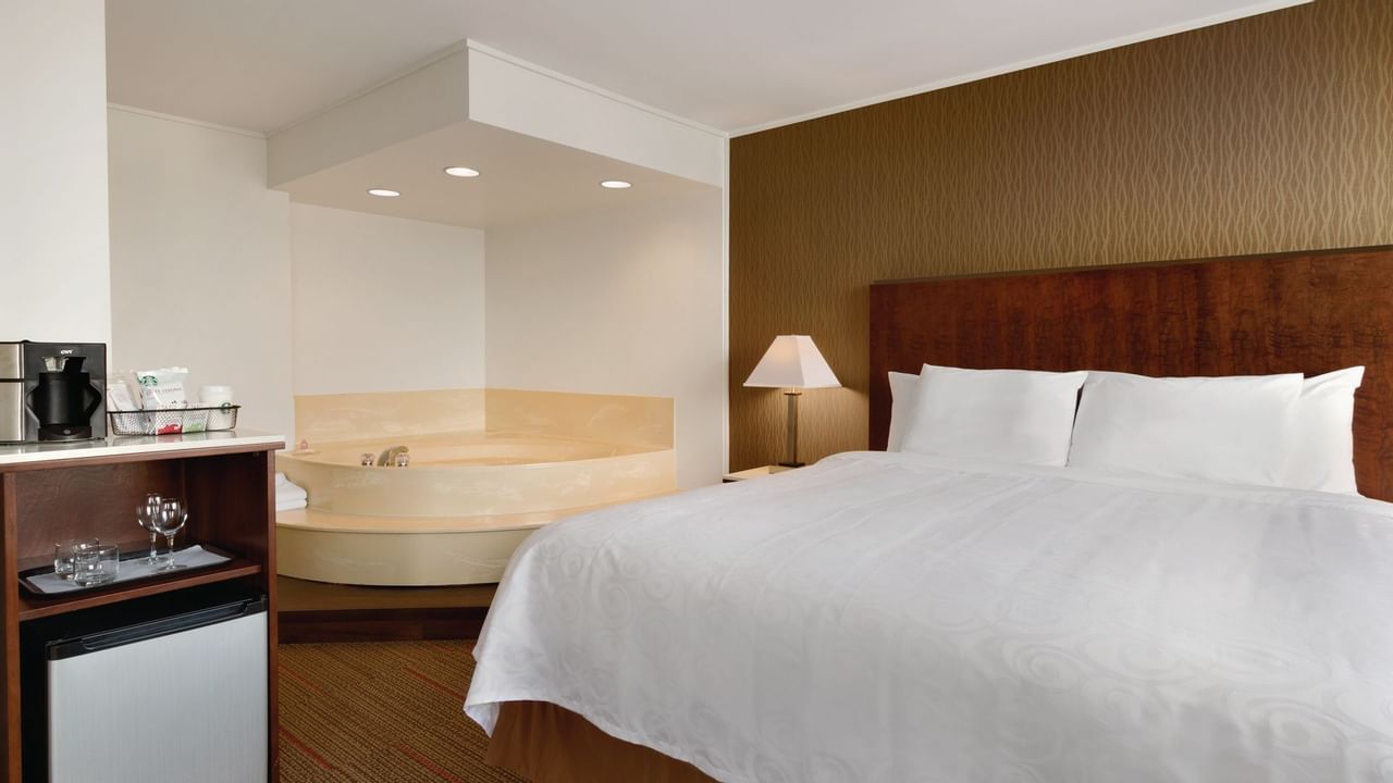 Bed and tub in hotel room