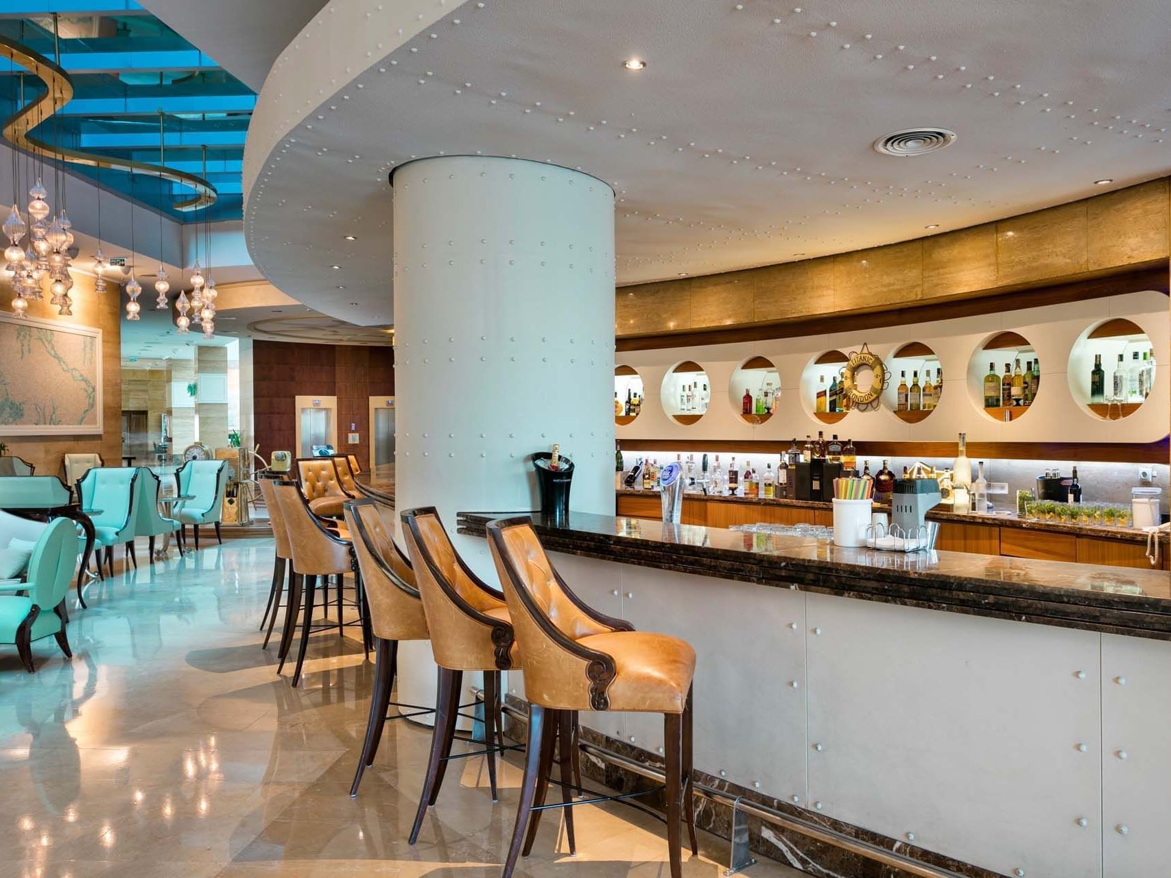 Bar counter area with high stools in Caprice Lobby Bar at Titanic Deluxe Lara