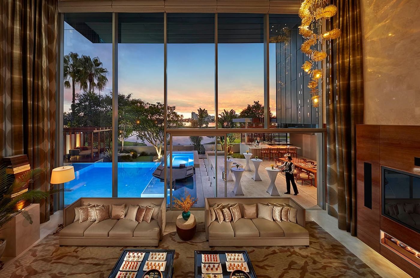 Indoor Lounge area with a pool view at Crown Hotel Perth