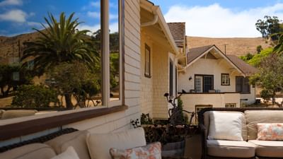 Exterior view with outdoor sofa seating at Banning House Lodge